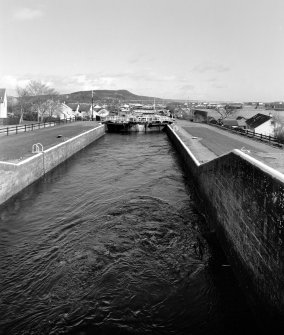 Inverness, Muirtown Swing Bridge over Caledonian Canal
Distant view from south west of bridge, with several of the Muirtown Locks in foreground
Digital image of D 64103