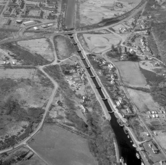 Scanned image of oblique aerial view showing Neptune's Staircase, Banavie Swing Bridge and Banavie Railway Swing Bridge
