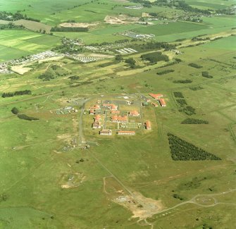 Scanned image of oblique aerial view of Buddon Camp with the magazine and dismantled battery in the foreground, taken from the SSW.