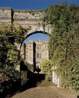 View from SE through the entrance arch to the front door