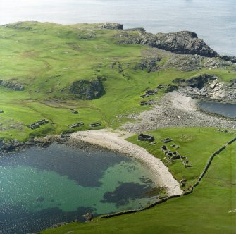 Oblique aerial view of the remains of the fishing station and homestead, Fethaland, North Roe taken from the E.