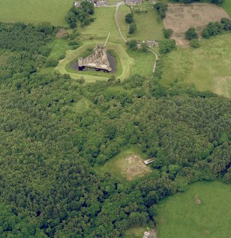 Digital image of oblique aerial view of Old Caerlaverock Castle centred on excavations with Caerlaverock Castle adjacent, taken from the SSE.