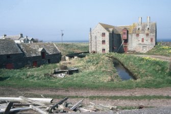 View from S. The old mill is on the left, and the new mill, built in about 1900, is on the right.
Copy of 35 mm colour transparency.
