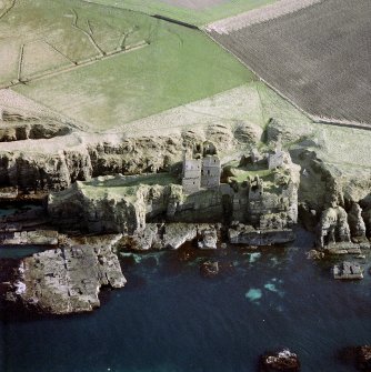 Oblique aerial photograph showing castles Girnigoe and Sinclair, and Castle Haven Dyke