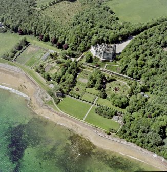 Oblique aerial view of Dunrobin Castle with the formal garden from NE.