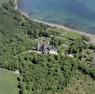 Oblique aerial view of Dunrobin Castle, walled garden and formal gardens, taken from the NW.