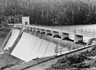 General view from N.
Scanned image of 'Mullardoch-Fasnakyle-Affric Project, Contract No. 10, Plate No. 386:
Benevean Dam from North Bank. Head Over Crest, 1 ft. 5/12/54'.