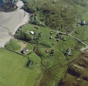 Oblique aerial view of Sorisdale centred on cottages, taken from the N.