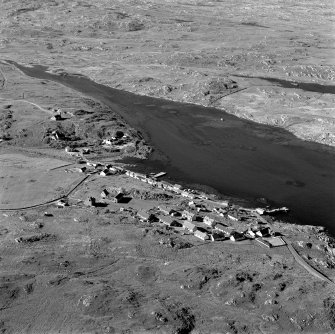 Oblique aerial view of Arinagour, taken from the south west, centred on the town.