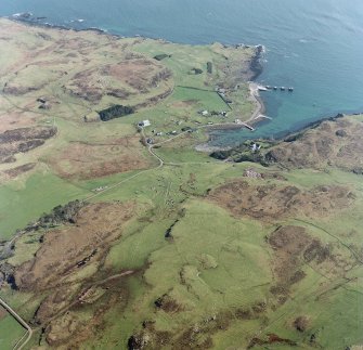 Oblique aerial view centred on Port Mor and the remains of the township with the chapel adjacent, taken from the NW.