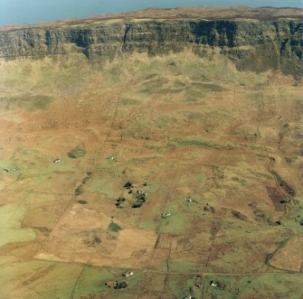 Oblique aerial view of the crofting township and field-system with farmstead adjacent taken from the WSW.