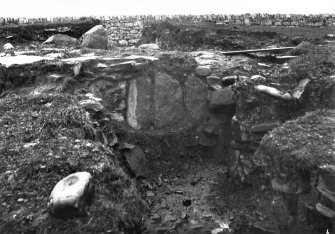 Excavation photograph showing a stone-built feature.