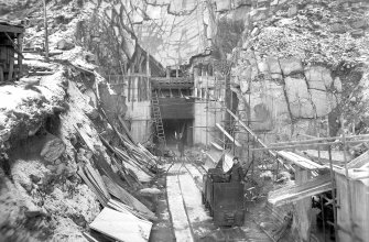 View of Mullardoch-Fasnakyle-Affric Project, contract no 10, Mullardoch Tunnel. Concreting of outfall portal, section of stoplogs in position.
Scan of glass negative no. 276, Box 1042/1