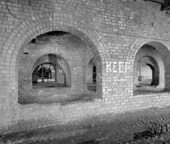 Newtongrange, Lady Victoria Colliery, Pithead Building (tub Circuit, Tippler Section, Picking Tables)
Interior view from W at ground level beneath the Picking Tables.  Railway wagons passed through this area and were filled from hoppers and conveyors above