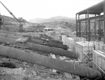 Loch Sloy Project, Contract 13 - Exterior steel pipeline. Pipeline entering power station.
Scanned image of glass negative no. 1, Box 1115.