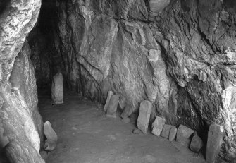 View of carved stones in St Ninian's Cave.
