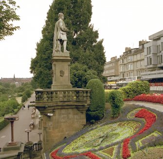 View of floral clock and statue of Alan Ramsay from east
