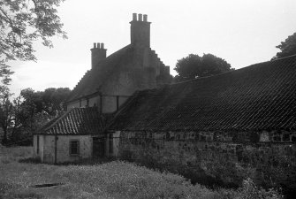 View of farmhouse and steading from NW.