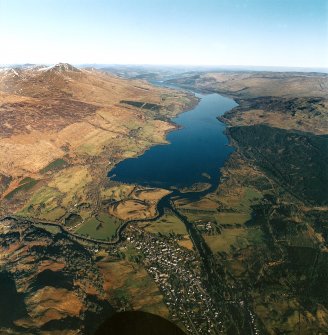 Oblique aerial view centred on Loch Tay with Killin village adjacent, taken from the SW.
