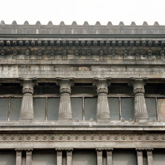 View of third floor columns on W facade.