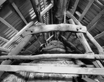Interior: Detail of upper half of cruck no. 2, Long House, Camserney Farm.