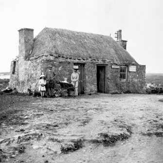 View of telegraph office at Creagorry, Benbecula, with family.