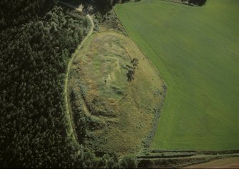 Oblique aerial view centred on the remains of Ormond castle and possible fort, taken from the NE.