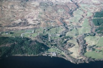 Oblique aerial view of the landscape and field systems at Morenish, Lochtayside, from Tomocrocher in the west to Edramucky in the east. Centred on the former farms of Blarliargan and Milton Morenish (now a holiday park) and Rynachulig.  Taken from SE.