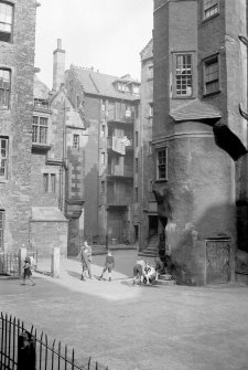 General view of rear of Baxter's Close and Lady Stair's Close, Edinburgh, with children in foreground.