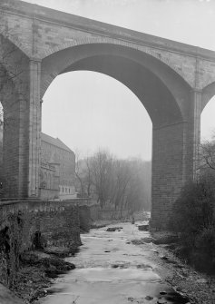 Looking up below from the Water of Leith of Leith Clayton and Dean Bridge, showing old granary