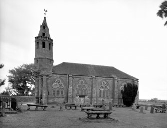 View from south showing spire and plate tracery.