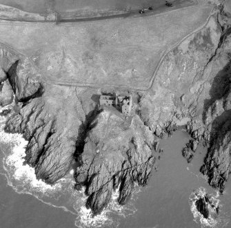Oblique aerial view centred on Dunskey Castle.