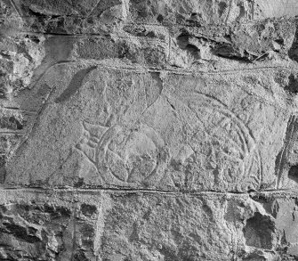 View of the Advie Pictish symbol stone set into the church wall.
