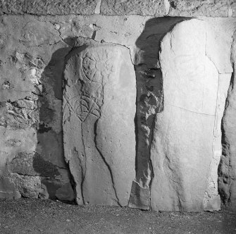 View of Knockando Pictish symbol stones nos 1 and 2 set into wall of churchyard.