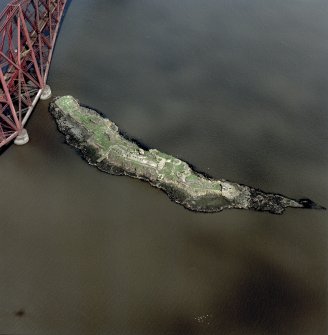 Scanned image of oblique aerial view of The Forth Bridge and Inch Garvie centred on the rail bridge and the remains of a castle, battery, coast battery and artillery fortifications, taken from the SSE.