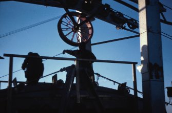 Spinning wheel crossing top of main tower. Handling crew gliding dead wires into saddle.
Copy of original 35mm colour transparency
Survey of Private Collection