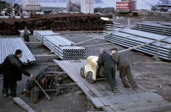 Cleaning out galvanised duct pipes in south yard.
Copy of original 35mm colour transparency
Survey of Private Collection