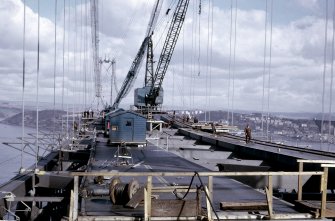 View north of erection of main span suspended structure with two deck panels positioned in each roadway.
Copy of original 35mm colour transparency
Survey of Private Collection