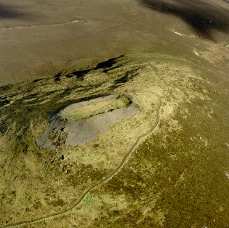 Oblique aerial view of Tap o' Noth centred on the fort, taken from the SW.