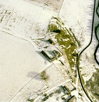 Scanned image of Badenyon, oblique aerial view, taken from the NW, centred on the site of Badenyon Castle and the farmsteading.