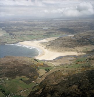 Oblique aerial view centred on Torrisdale Bay with the village of Bettyhill adjacent, taken from the WNW.