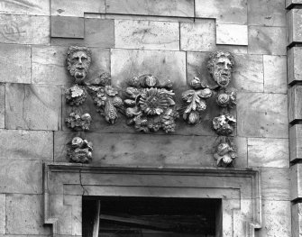 Detail of carved decoration above window, E elevation.