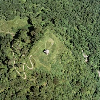 Oblique aerial view centred on the tower and remains of the fort, taken from the W.