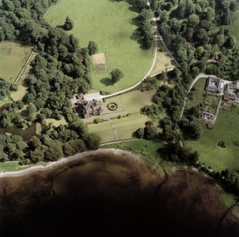 Oblique aerial view centred on Ardkinglas House with the steading and remains of the old house adjacent, taken from the NW.