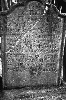 Glasgow, Carmunnock, Kirk Road, Carmunnock Parish Church.
View of East face of gravestone of William Gilmour's children.
Insc: 'Here Lies The bod=ys of Three children Belonging to John Gil=mour & Agnes Cum=ming. John Gilmour W=ho Died May 1775 aged 2 years & a half, Willi=am Gilmour Who Died Feb 1784 aged 5 years & a half, Jean Gilmour Who Died Septr. 1789 aged 5 Months'.