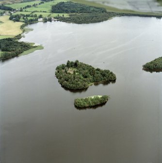 General oblique aerial view centred on the remains of the priory and site of the castle, taken from the WSW.