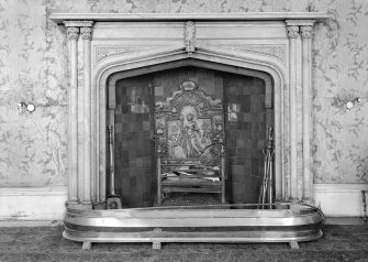 Skye, Armadale Castle, interior.
Detail of dining room fire-place. Gothic design surround with cast iron fireback depicting a lady with a mirror.