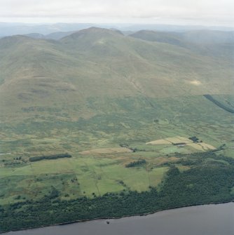 General oblique aerial view looking across the farmstead of Carie towards Ben Lawers, taken from the SSE.