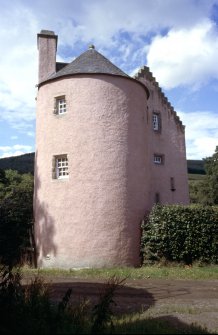 View of tower with crow-stepped gable behind.