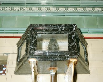 Rothesay, West Pier. Detail of glass-sided cistern, one of three above the wall-mounted urinal stalls. 